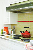 Red kettle on electric hob in Berkshires kitchen, Massachusetts, Connecticut, USA