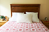 White pillows against wooden carved headboard in Berkshires home, Massachusetts, Connecticut, USA