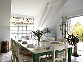 Dining room with nautical ship wheel