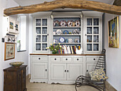Rustic cabinet with collection of crockery