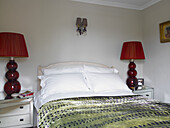 Bedroom detail with red lamps in city of Bath home Somerset, England, UK