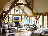 Open plan timber framed living room of Somerset new build in rural England UK