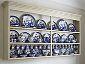 Full set of chinaware in wall mounted cabinet city of Bath home Somerset, UK