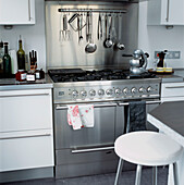 Large stainless steel cooker range with kitchen utensils