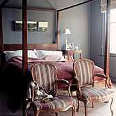 Country style bedroom with four poster bed