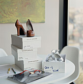 White dining room table top with shoe boxes