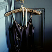 Evening dress hung on a hanger on a door knob