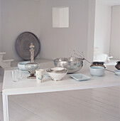 Contemporary open plan white dining room with tableware display