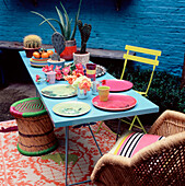 Colourful table setting in a small garden