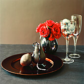 Tabletop with tableware glassware flower display and Christmas decorations