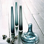Blue and grey glass coloured vases on a painted wooden floor