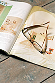 pair of spectacles on a magazine