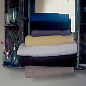 Pile of folded towels in a bathroom cabinet
