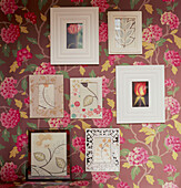 Bold patterned wallpaper with framed pictures