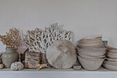 Assorted ceramics and coral on mantlepiece in Hove kitchen East Sussex England UK