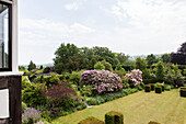 View from house of lawn in garden Haslemere, Surrey, UK