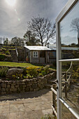 View through back door to garden steps and shed in Dartmoor Devon England UK