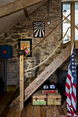 Framed artwork and wooden steps with US flag in barn conversion Dartmoor Devon England UK