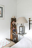 Chrome lamp and soft toys at bedside in Winchester home UK