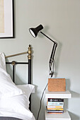Desk lamp at bedside in Reading home Berkshire England UK