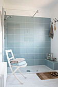 Glass tiled shower cubicle in London home