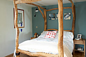 Four poster bed made of driftwood in Gurnard beach house