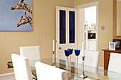 Giraffe's heads on canvas in contemporary blue and white dining room