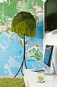 Artificial tree floor lamp and map with plasma screen in Sydney apartment Australia
