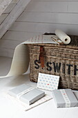 Gift wrapped presents with vintage basket in Isle of Wight home, UK