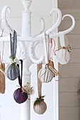 Assorted pot pourri hangs from hat stand in Isle of Wight home, UK