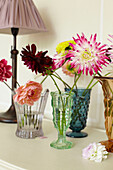 Single stem flowers in cut glass vases in East Cowes home, Isle of Wight, UK
