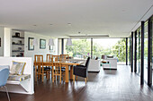 Wooden table and chairs in open plan modern Isle of Wight home with vinyl flooring throughout UK