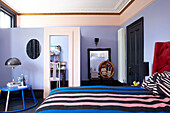 Partitioned lilac bedroom in Hastings townhouse East Sussex England UK