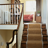 Wooden hall staircase and landing with sisal carpet runner