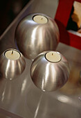Brushed steel candleholders