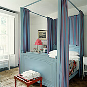 Blue four poster bed