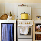 White tiled kitchen with stove