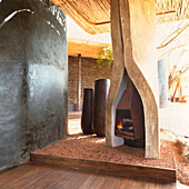 Concrete sculptured open fireplace