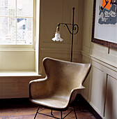 Unlined fibreglass shell chair in window setting