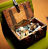 Open treasure chest on chair