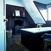 Panelled bathroom with fireplace