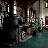 Man working in a cider brandy distillery