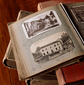 Old photographs of a property in antique albums