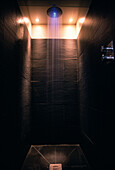 Black slate tiles in shower room with coloured light in the shower head