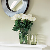 Mantelpiece with flower display and mirror