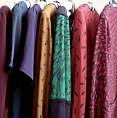 Detail of clothes hanging in a wardrobe