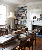 Artists workroom with reference books in London townhouse, UK