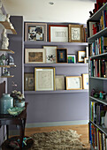 The hallway acts as a library and gallery space freeing up the main rooms from too much clutter 