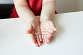 Cupped hands of a young girl