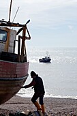 Fishermen along the Stade at Hastings Old Town East Sussex UK